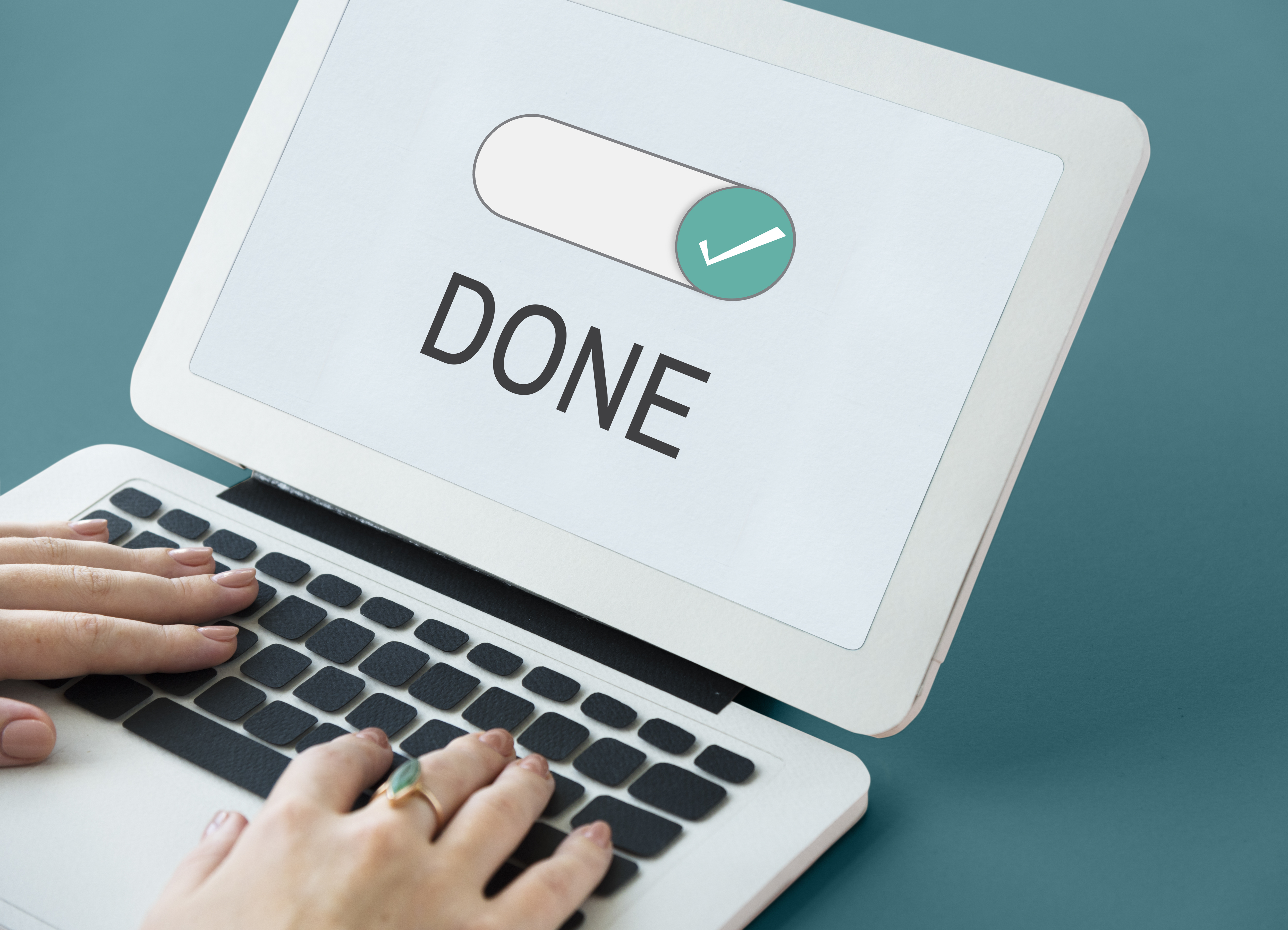 someone typing on a pc showing done