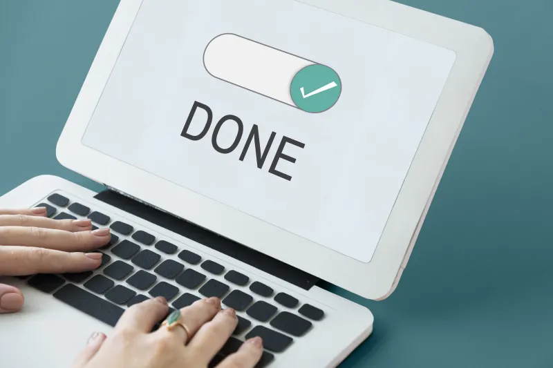 someone typing on a pc showing done